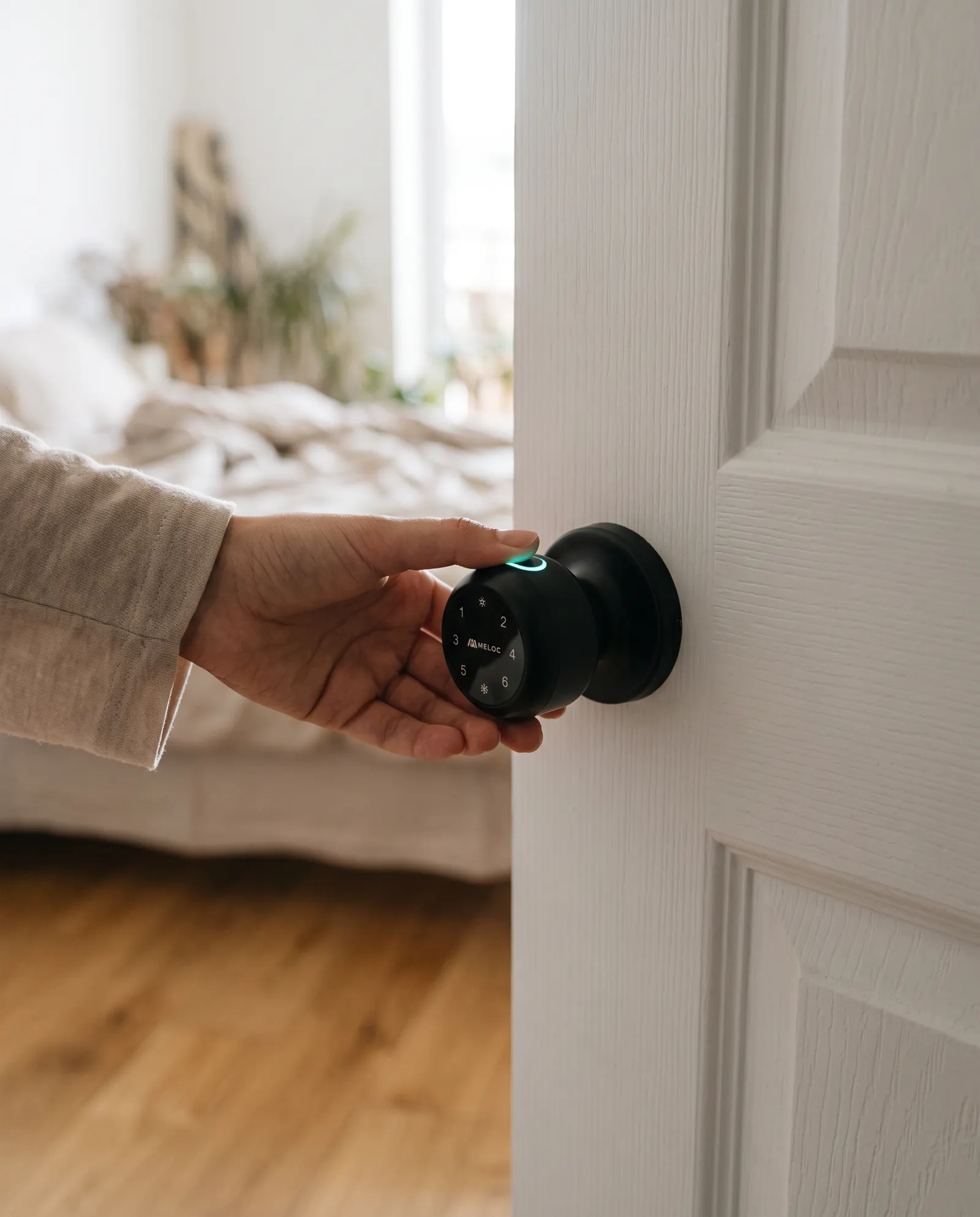 A Meloc Interior smart lock on a bedroom door