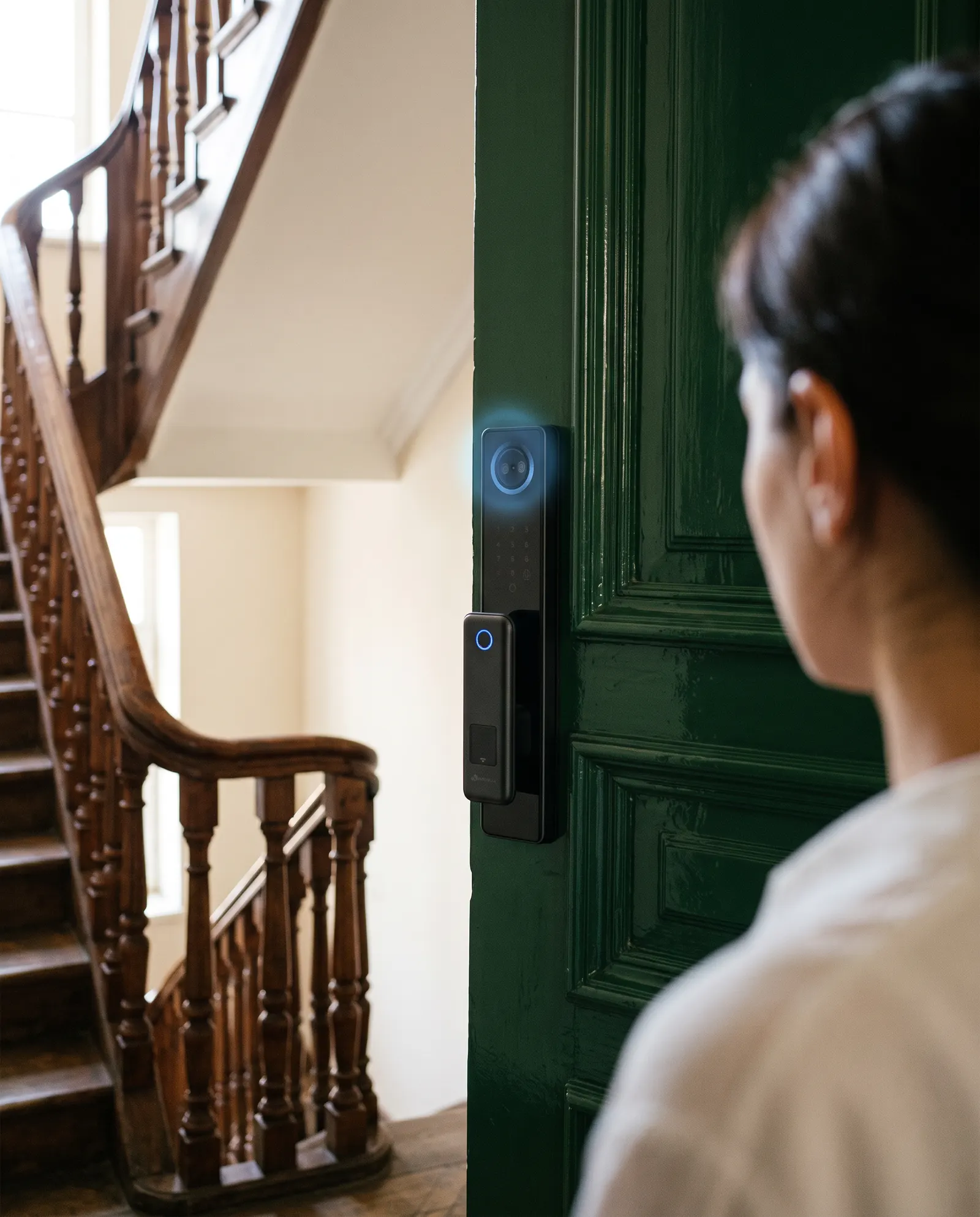 A smart lock with a camera and screen on a front door