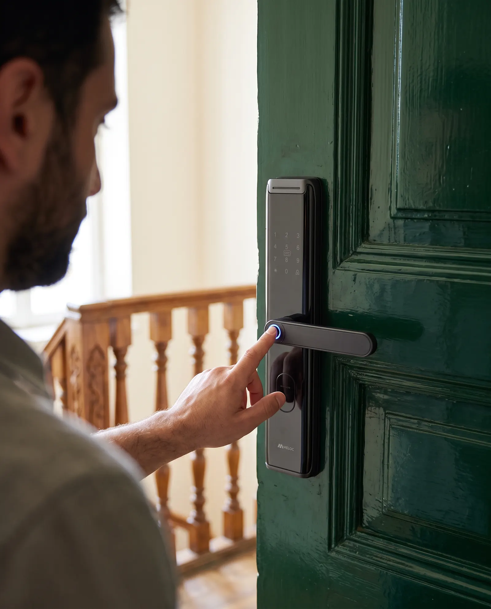 A Meloc Pro metal-bodied smart lock on a front door
